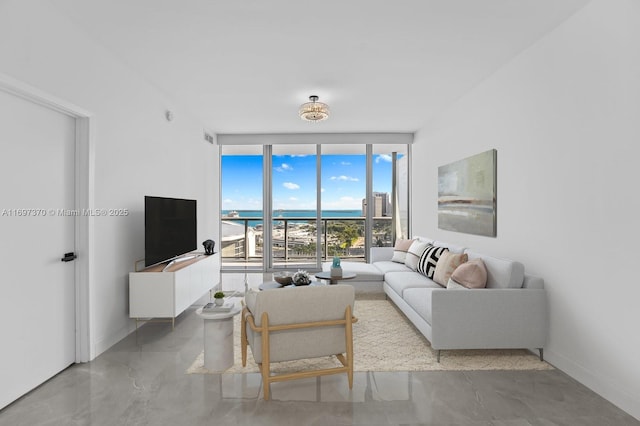 living room with floor to ceiling windows