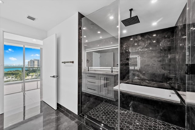 bathroom with vanity and plus walk in shower