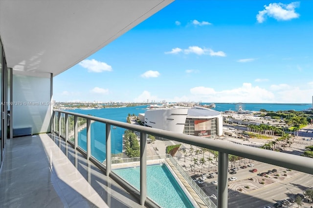 balcony featuring a water view