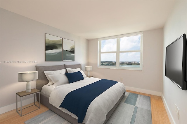 bedroom with light hardwood / wood-style floors