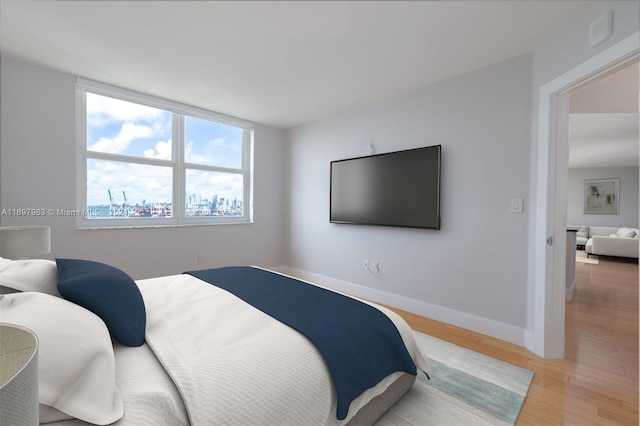 bedroom with light wood-type flooring