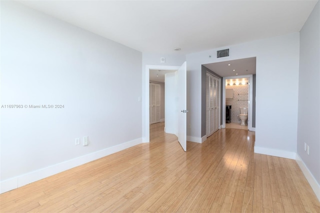 spare room featuring light hardwood / wood-style floors