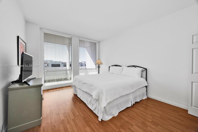 bedroom featuring wood-type flooring