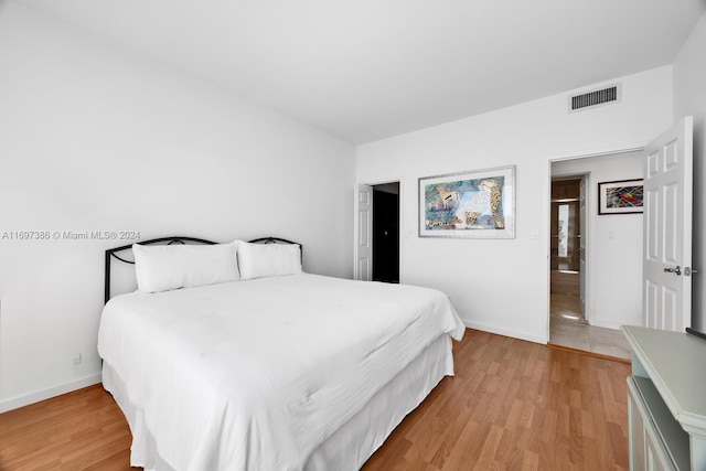 bedroom featuring light hardwood / wood-style floors