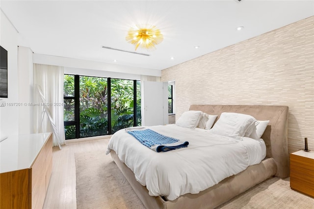 bedroom with light hardwood / wood-style floors