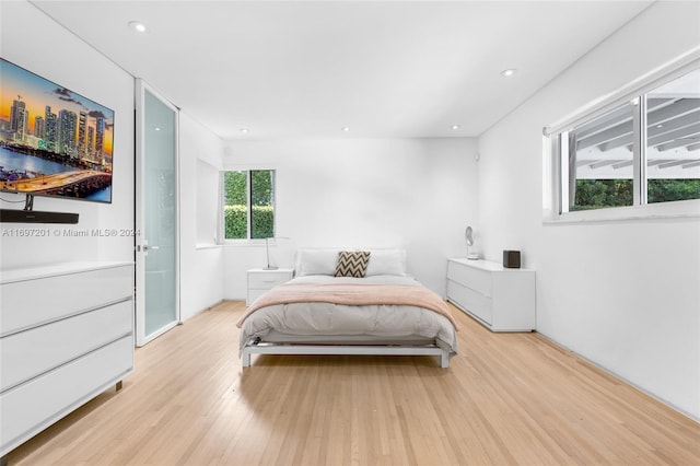 bedroom featuring light hardwood / wood-style floors