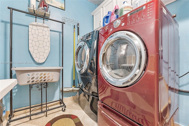 clothes washing area featuring washer and dryer