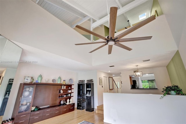 93 NE 17th Ct Unit 93, Fort Lauderdale, FL 33305 - living area with high vaulted ceiling, light wood finished floors, a ceiling fan, and beamed ceiling