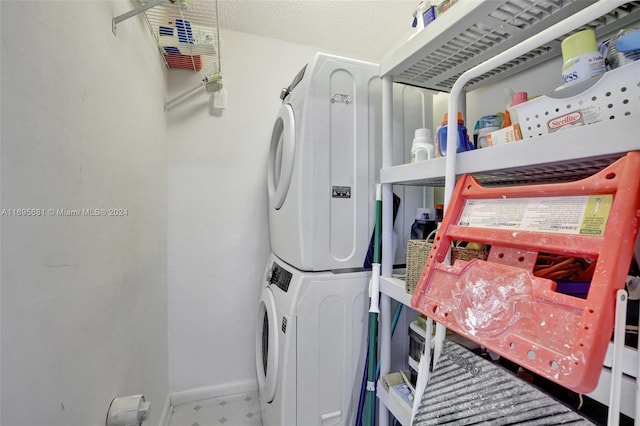 washroom with stacked washer / dryer