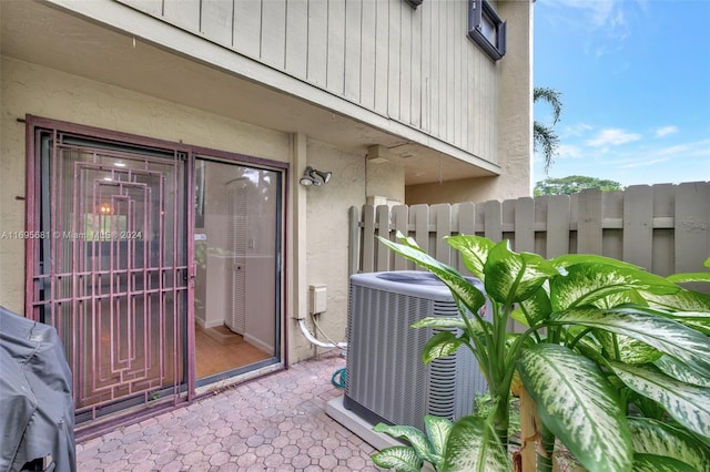 doorway to property featuring cooling unit