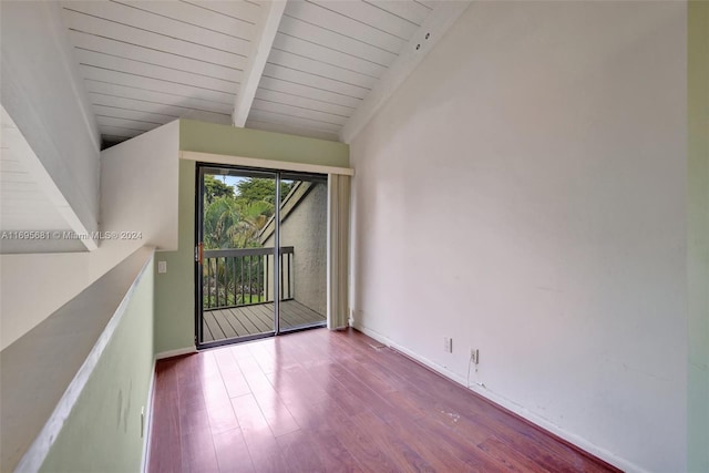 empty room with vaulted ceiling with beams, light wood-type flooring, and wooden ceiling