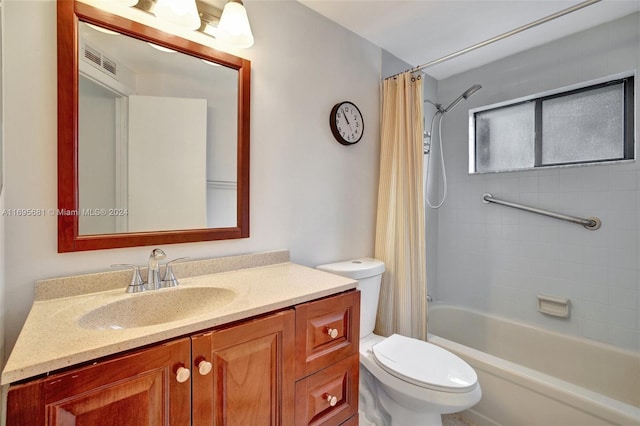 full bathroom featuring shower / bath combo, vanity, and toilet