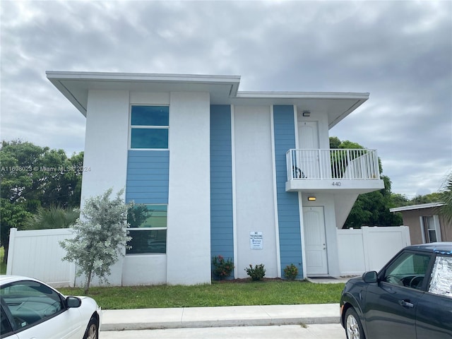 view of front of home with a balcony