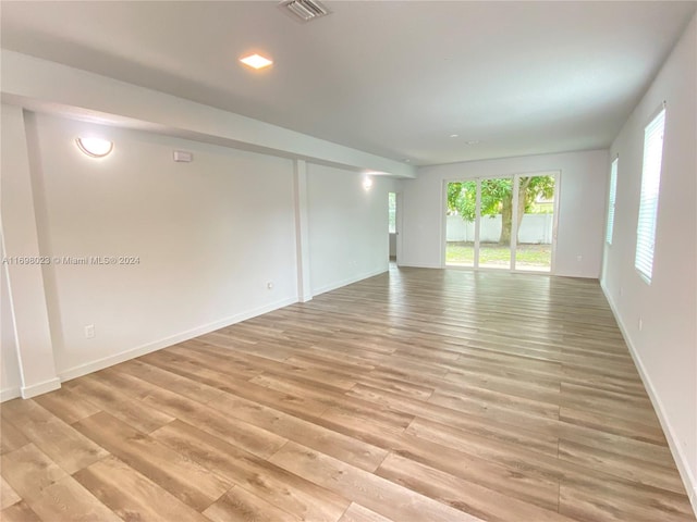 unfurnished room featuring light hardwood / wood-style floors