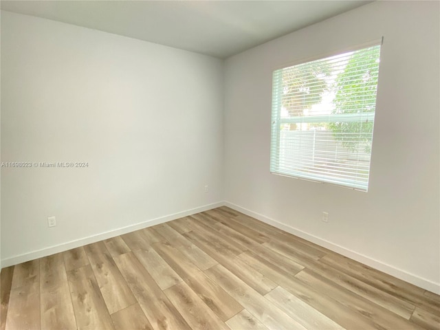 spare room with light wood-type flooring