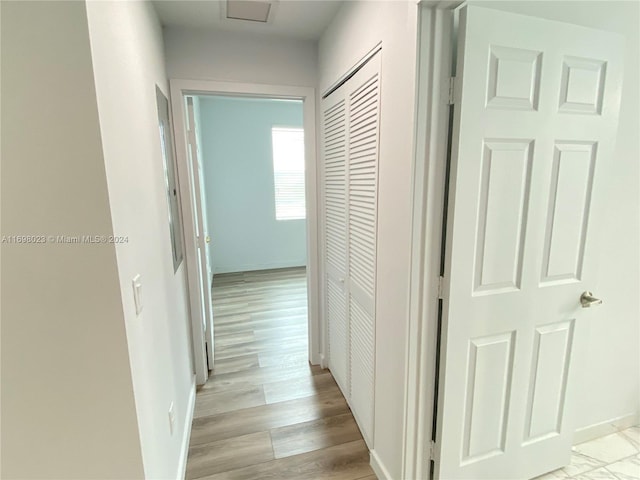 corridor featuring light hardwood / wood-style floors