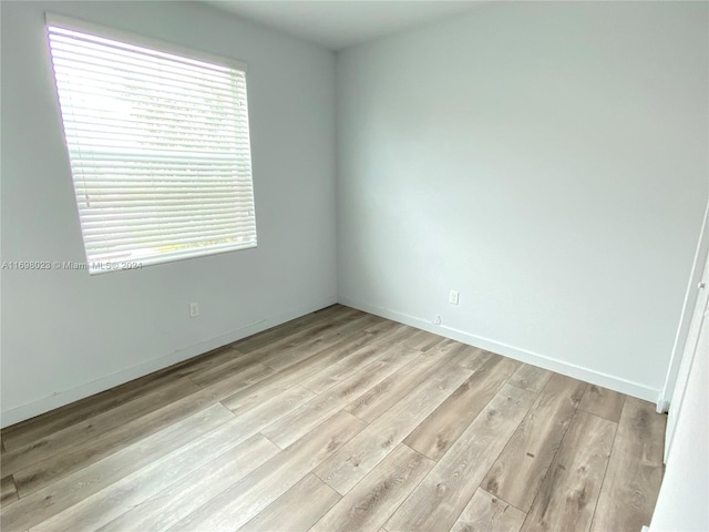 spare room with light hardwood / wood-style floors