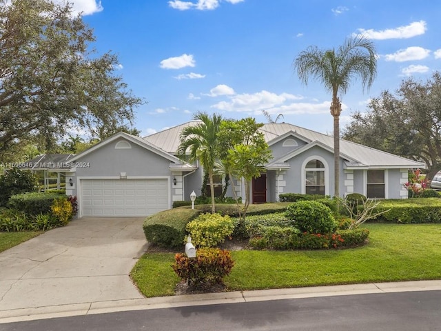 single story home with a garage and a front yard