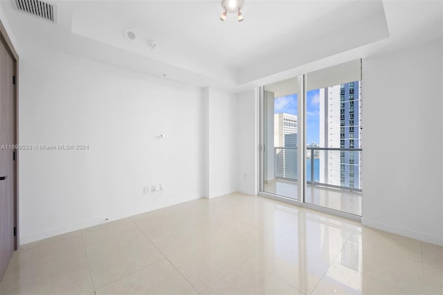 empty room with light tile patterned floors