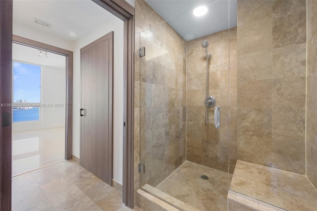 bathroom with a water view and a shower with door