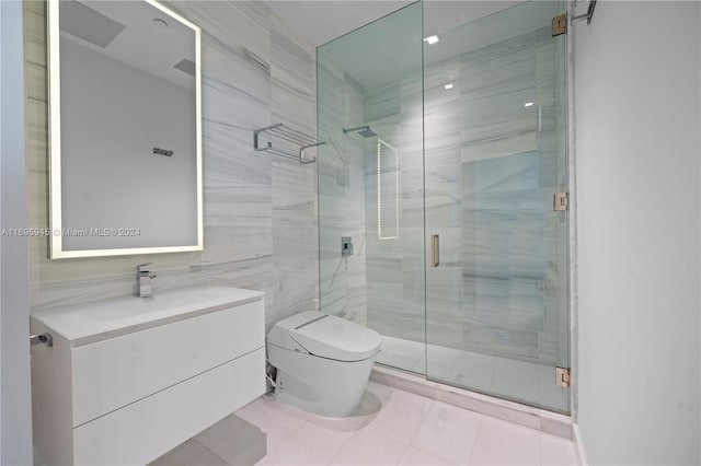 bathroom with vanity, toilet, a shower with door, and tile walls