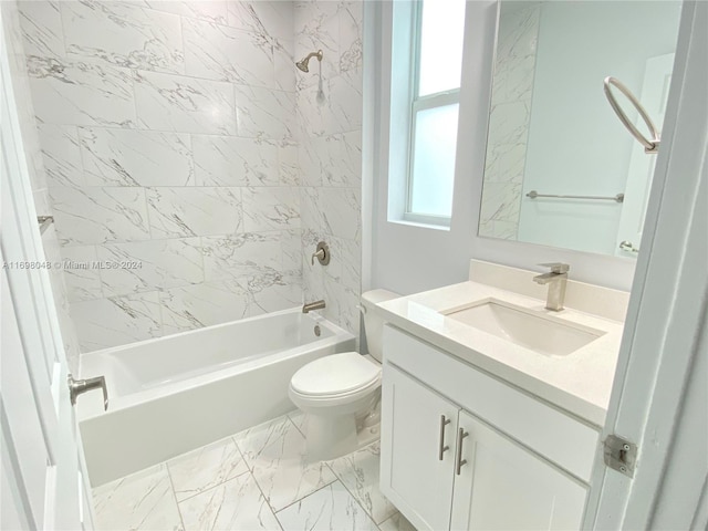 full bathroom with vanity, toilet, and tiled shower / bath