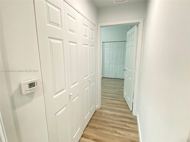 corridor featuring light hardwood / wood-style flooring