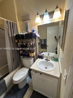 full bathroom with shower / bath combo, vanity, and toilet