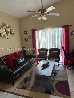 living room featuring tile patterned flooring and ceiling fan