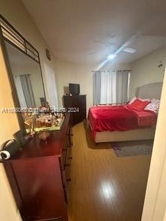 bedroom featuring hardwood / wood-style floors and ceiling fan