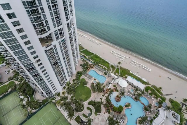 drone / aerial view featuring a view of the beach and a water view