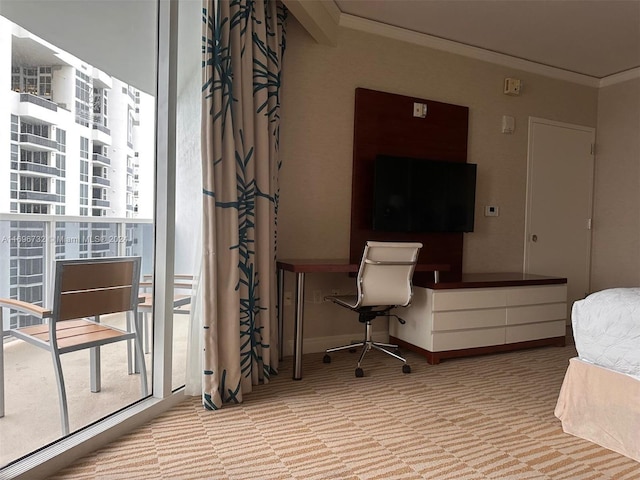 bedroom with built in desk and ornamental molding