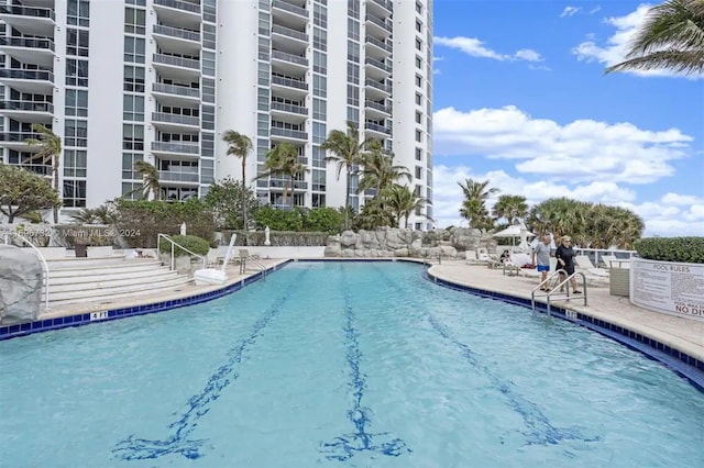 view of swimming pool with a patio area