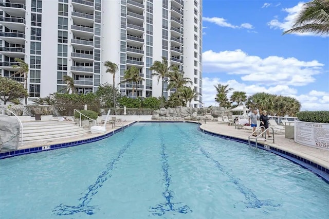 18001 Collins Ave Unit 1204, Sunny Isles Beach, FL 33160 - community pool featuring a patio area
