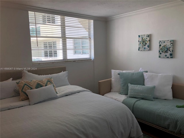 bedroom with crown molding