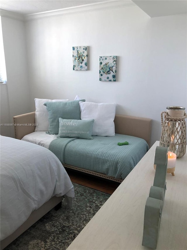 bedroom featuring crown molding