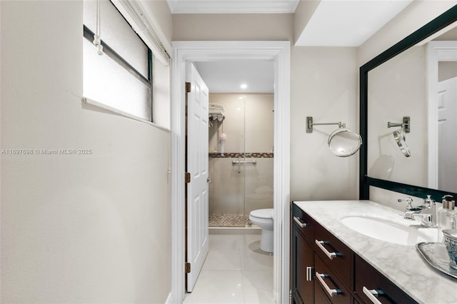 bathroom with tile patterned floors, a shower with door, vanity, and toilet