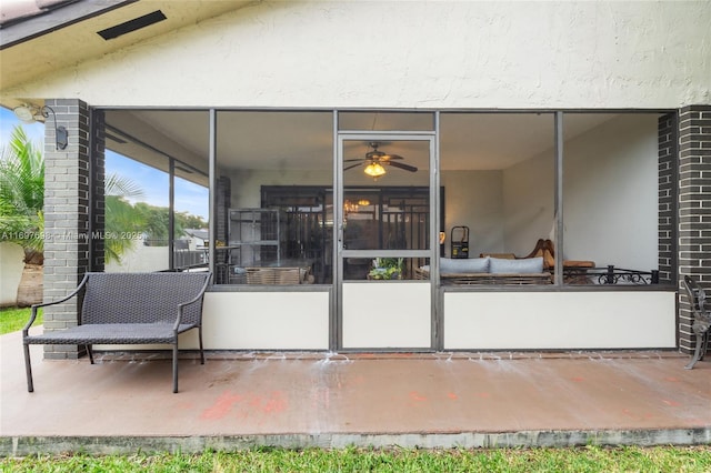 view of patio with a sunroom