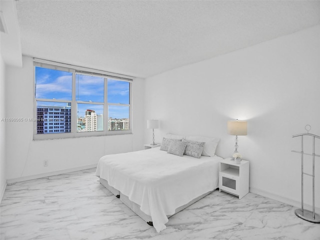 bedroom featuring a textured ceiling