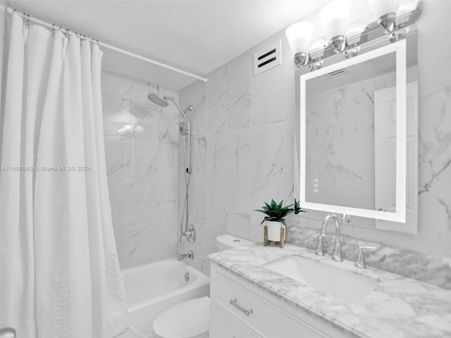 full bathroom with vanity, toilet, shower / bathtub combination with curtain, and a textured ceiling