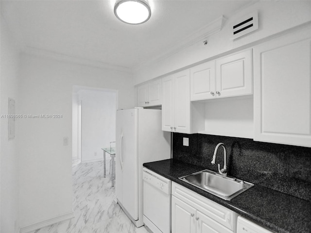 kitchen with backsplash, sink, white cabinets, and white appliances