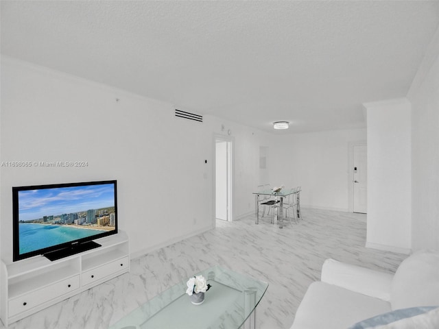 living room with a textured ceiling