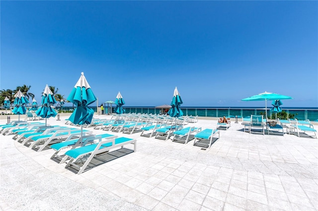 view of pool with a water view