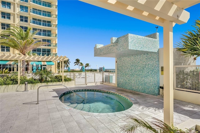 view of pool featuring a community hot tub and a pergola