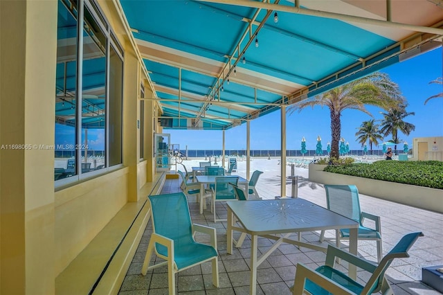 view of patio featuring a water view