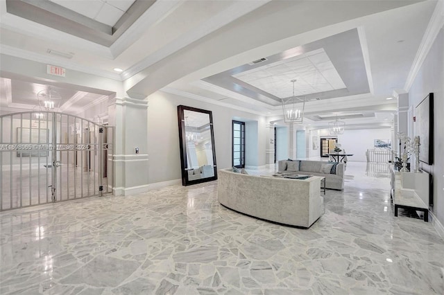 living room featuring a raised ceiling, ornamental molding, and an inviting chandelier