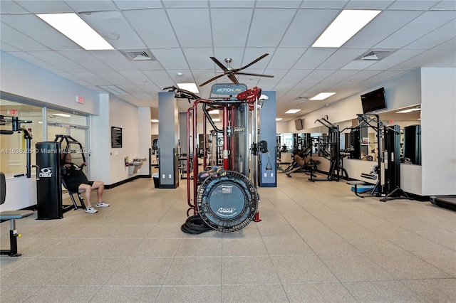 gym featuring a drop ceiling