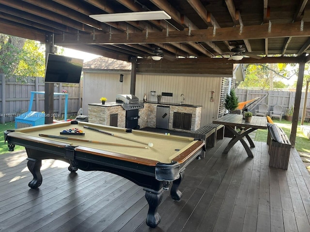 rec room featuring ceiling fan, sink, wood-type flooring, billiards, and wood walls