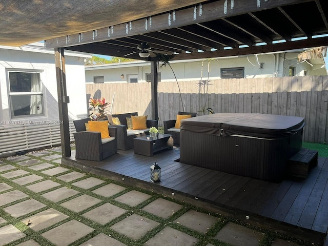 wooden deck featuring a hot tub