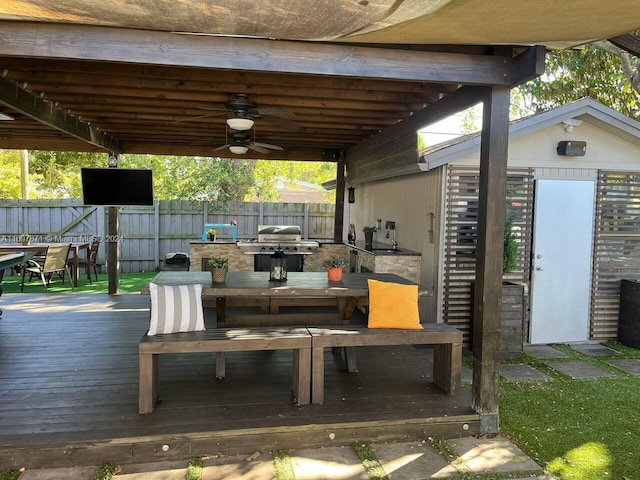 view of patio featuring grilling area, a deck, and ceiling fan